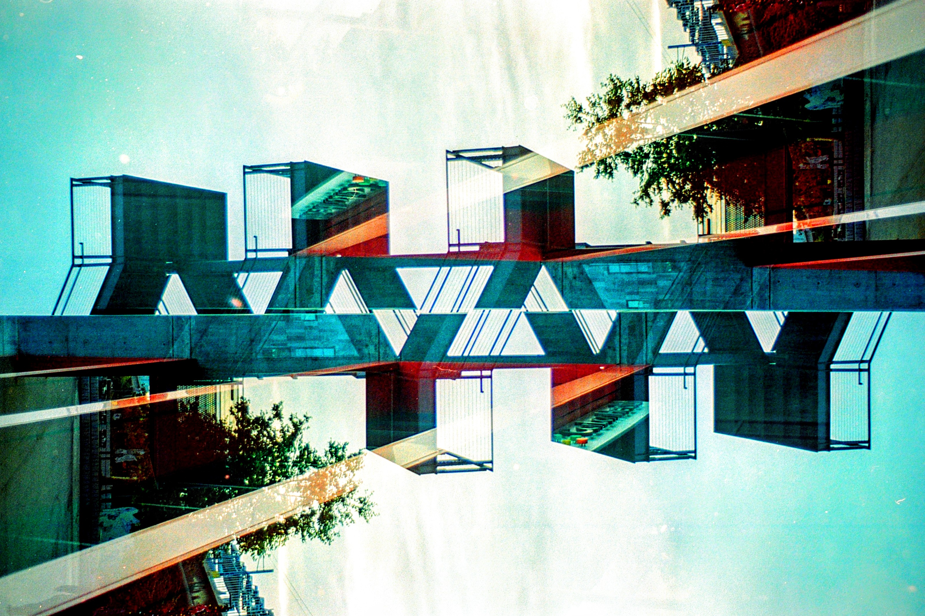 Teal and red architectural film double-exposure
