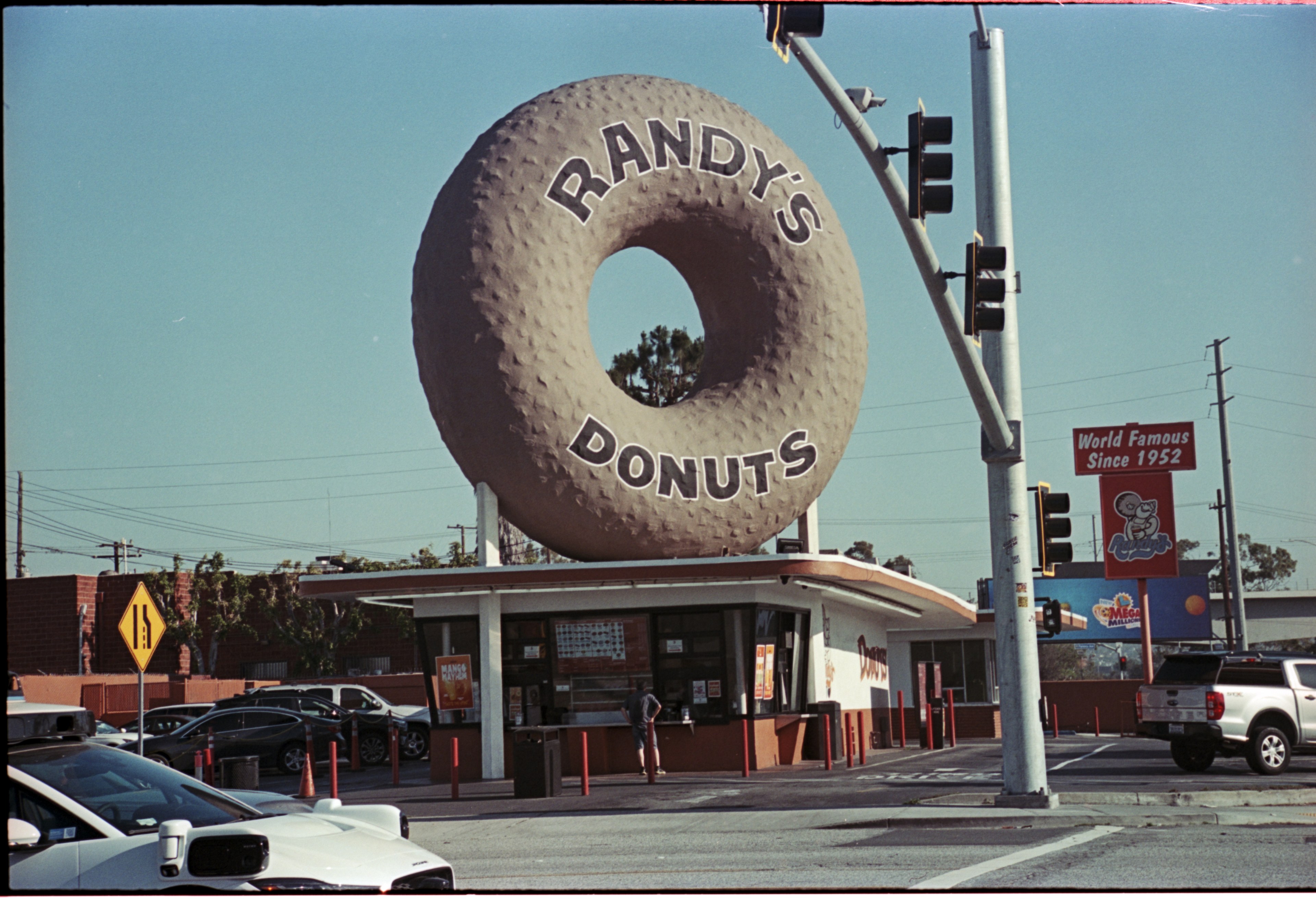 Randy's Donuts sign in an analog street photograph