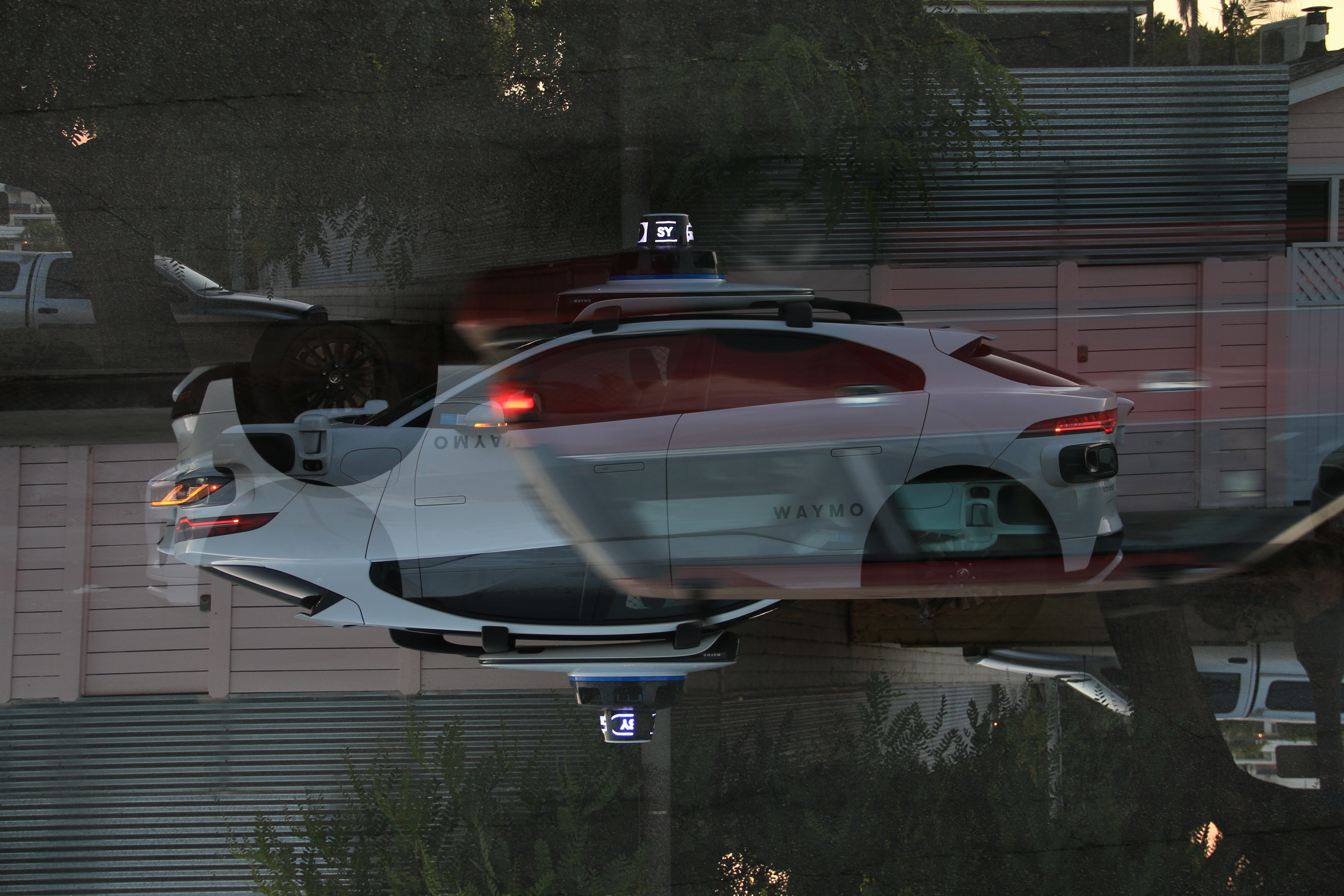 Cars and aircraft layered in a dark digital multi-exposure